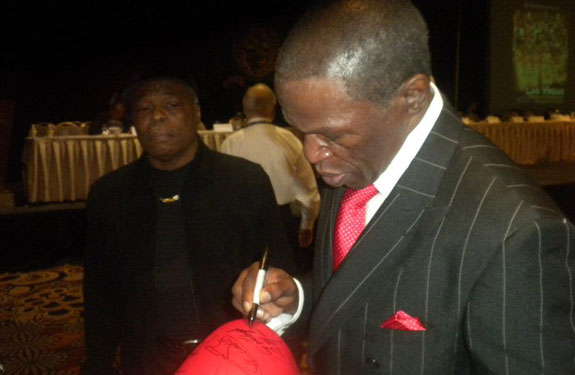 Floyd Mayweather Sr. signing autographs